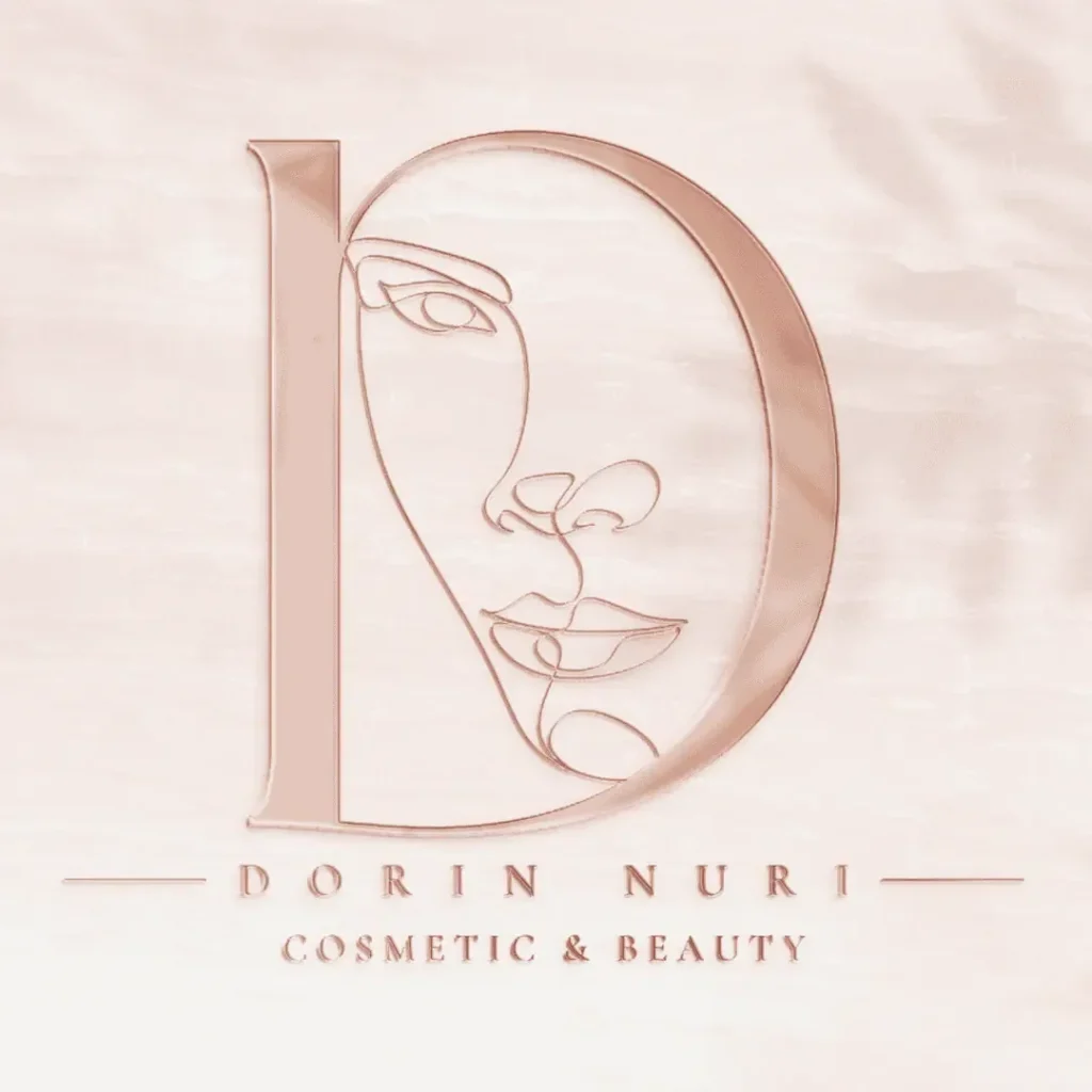 לוגו Dorin Nuri Cosmetic & Beauty בגוון זהב ורוד עם קו מתאר של פנים